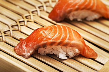 salmon sushi on a bamboo tray