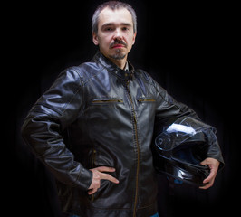 Adult motorcyclist in brown leather jacket.