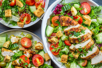Three healthy salads with fresh vegetables