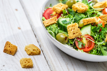 Closeup of salad with chicken and fresh vegetables