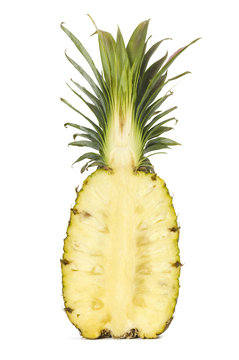 Pineapple cut in half on a white background.