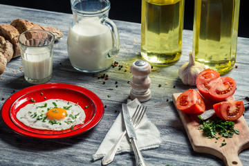 Fried eggs and bread for breakfast with vegetables