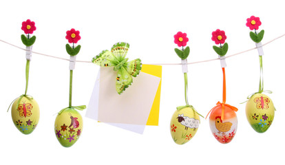 Easter eggs hanging on a string - obrazy, fototapety, plakaty