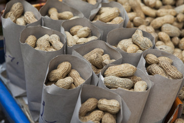 peanuts in a miniature burlap bag