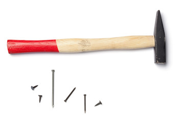 Wooden hammer with nails