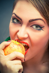 Young pretty woman with apple