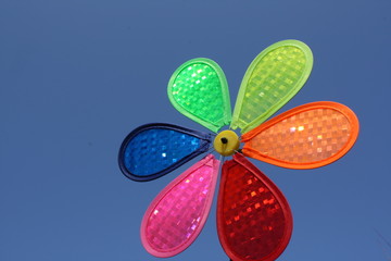 colouful toy windmill on a blue sky background