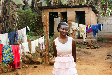 Young African woman in backyard