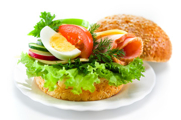 sandwich with ham, cheese, fresh vegetables and egg