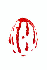 Red paint shaped in form of egg