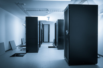 server cabinets inside data center room