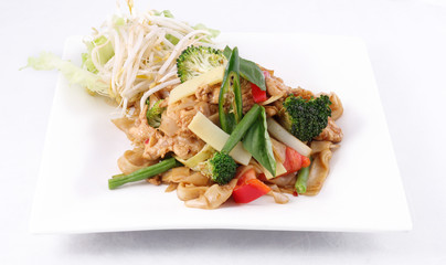 Flat rice noodle stir fried with Thai herb  and basil.