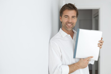 Nice Man Pointing A Blank Document