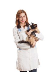 female in medical uniform holding a Siamese cat