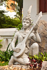 fairy statue with her spinet art of thailand