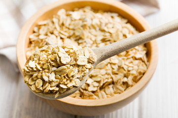 oat flakes on a wooden spoon