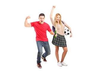 Full length portrait of a male and female football supporters