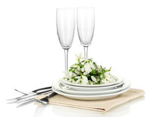 Serving dishes and snowdrops isolated on white