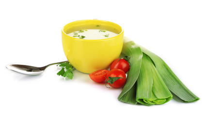 Diet soup with vegetables in cup isolated on white