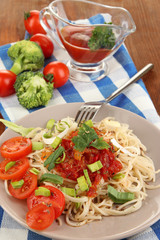 Tasty spaghetti with sauce and vegetables