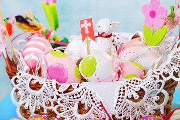 easter basket with eggs and sheep figurine