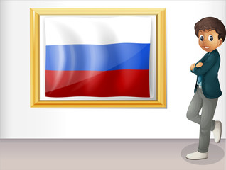 A man beside the framed flag of Russia