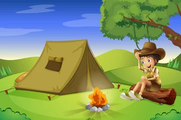 Fotobehang Een jongen met een tent en een kampvuur © GraphicsRF