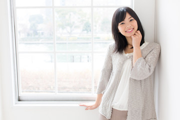 attractive asian woman relaxing in the room