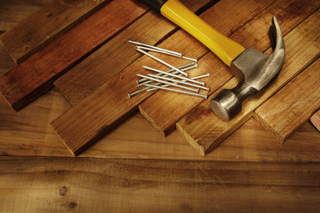 Carpentry still life hammer and nails on wood