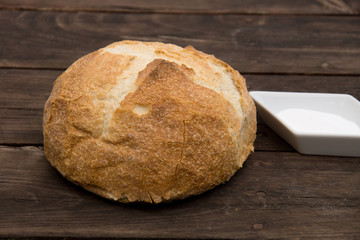 Bread on wood with salt