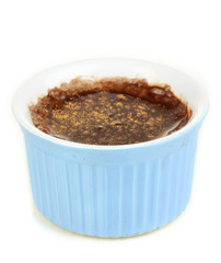 Chocolate pudding in bowl for baking isolated on white