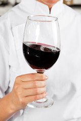 Chef Holding Glass Of Red Wine