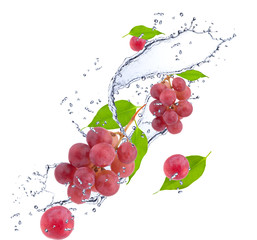 Fototapeta na wymiar Grape in water splash, isolated on white background 