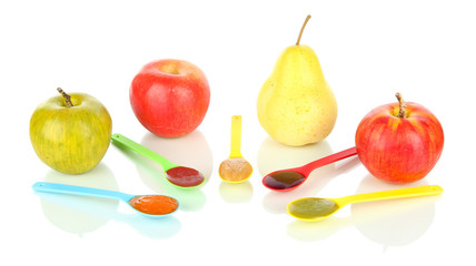 Baby puree in spoons with fruits isolated on white