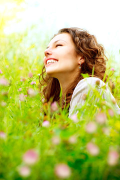 Beautiful Young Woman Outdoors. Enjoy Nature. Meadow