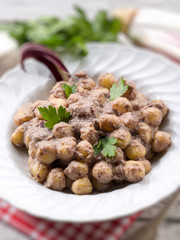 gnocchi with chicory and ricotta sauce, selective focus
