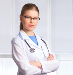 Beautiful Woman Doctor in Glasses Looking at the Camera