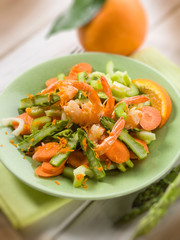 salad with shrimp asparagus carrot and celery, selective focus