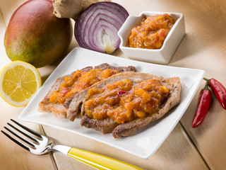 grilled steak with mango sauce