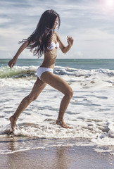 Sexy Woman Girl in Bikini Running on Beach