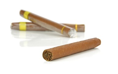 A group of cigars on a white background
