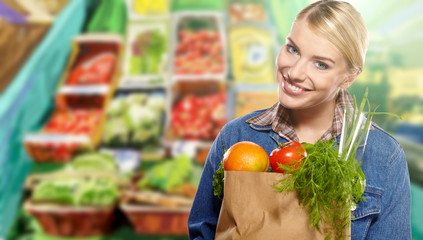 Woman grocery shopping at the local market