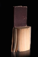 Open old book and cover, vintage objects