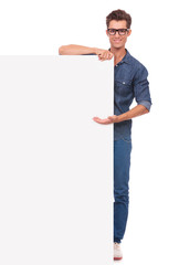 man presents big board