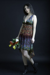 Beautiful young girl with a bouquet of flowers, Spring. studio p