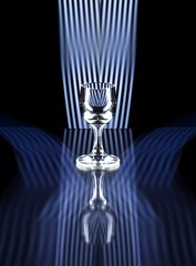 Glass of alcohol on disco background, party