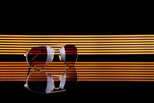 Sunglasses on colorful background, copyspace