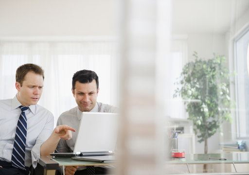 Businessmen working together in office