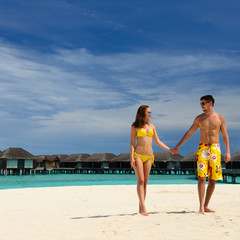 Fototapeta premium Couple on a beach at Maldives