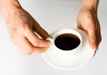 Businessman holding a cup of coffee